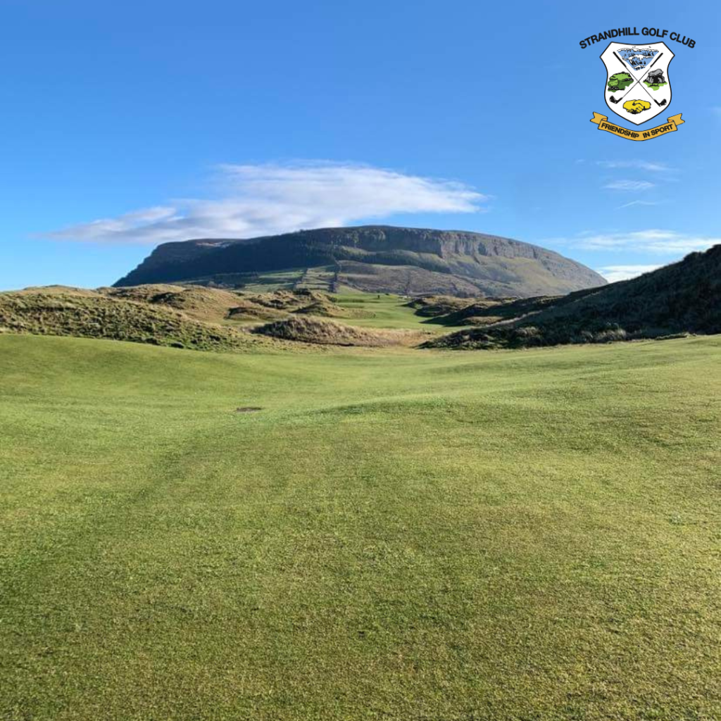 fairway with mountains in the far background