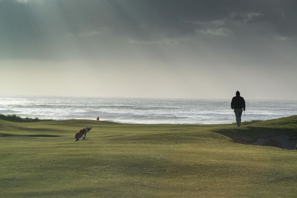 golfer walking to the green