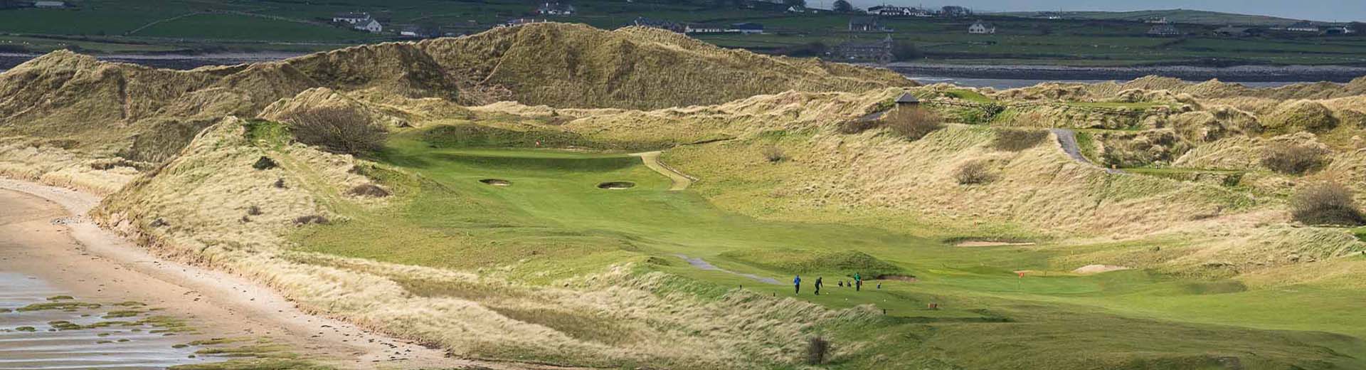 Golf course valley with players