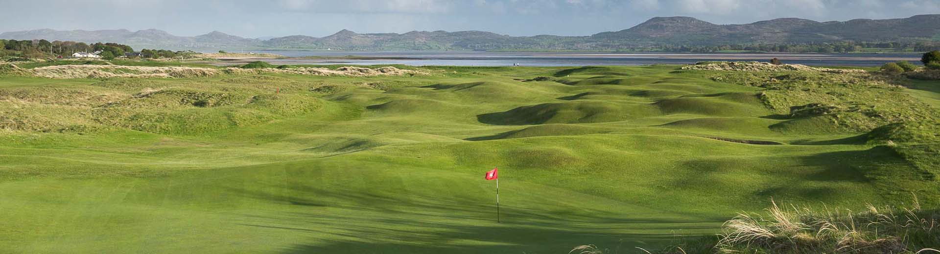 Golf course with flag and valley