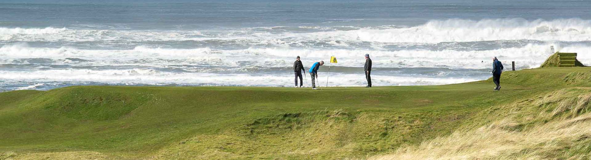 View of golf course and players by hole